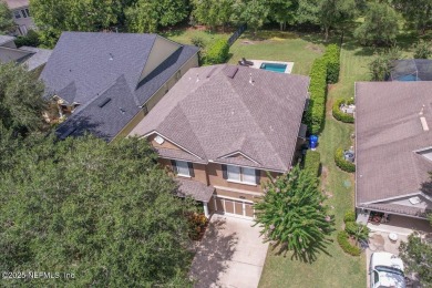 Outdoors is where you'll truly live in this gorgeous pool home on St. Johns Golf and Country Club in Florida - for sale on GolfHomes.com, golf home, golf lot