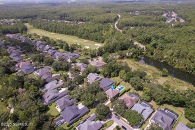 Outdoors is where you'll truly live in this gorgeous pool home on St. Johns Golf and Country Club in Florida - for sale on GolfHomes.com, golf home, golf lot