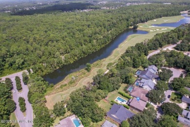 Outdoors is where you'll truly live in this gorgeous pool home on St. Johns Golf and Country Club in Florida - for sale on GolfHomes.com, golf home, golf lot