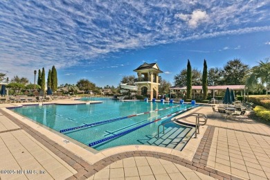 Outdoors is where you'll truly live in this gorgeous pool home on St. Johns Golf and Country Club in Florida - for sale on GolfHomes.com, golf home, golf lot
