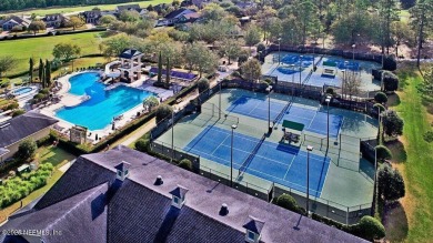 Outdoors is where you'll truly live in this gorgeous pool home on St. Johns Golf and Country Club in Florida - for sale on GolfHomes.com, golf home, golf lot