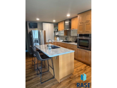 Step into this spacious 5 bedroom home offering an open floor on Wild Oak Golf Club in South Dakota - for sale on GolfHomes.com, golf home, golf lot
