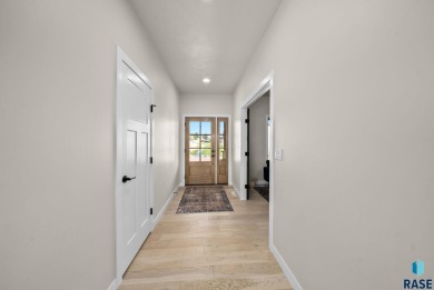 Experience luxury living in this beautiful two-story walkout on Willow Run Golf Course in South Dakota - for sale on GolfHomes.com, golf home, golf lot