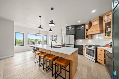 Experience luxury living in this beautiful two-story walkout on Willow Run Golf Course in South Dakota - for sale on GolfHomes.com, golf home, golf lot