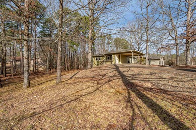Welcome to this charming bungalow nestled in the heart of Hot on Cortez Golf Course in Arkansas - for sale on GolfHomes.com, golf home, golf lot