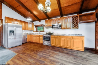 Like something out of Storybook Forest- Tucked beneath a canopy on Paradise Lake Golf Course in West Virginia - for sale on GolfHomes.com, golf home, golf lot