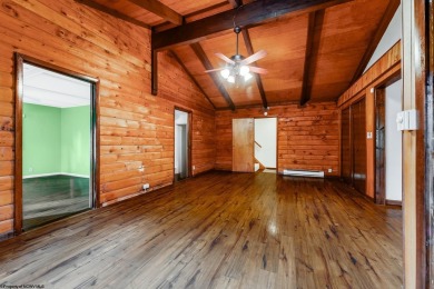 Like something out of Storybook Forest- Tucked beneath a canopy on Paradise Lake Golf Course in West Virginia - for sale on GolfHomes.com, golf home, golf lot