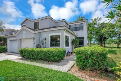 Beautiful 3BR/2.5BA townhouse with stunning golf and lake views on Woodmont Country Club in Florida - for sale on GolfHomes.com, golf home, golf lot