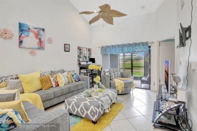 Beautiful 3BR/2.5BA townhouse with stunning golf and lake views on Woodmont Country Club in Florida - for sale on GolfHomes.com, golf home, golf lot