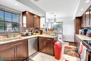Beautiful 3BR/2.5BA townhouse with stunning golf and lake views on Woodmont Country Club in Florida - for sale on GolfHomes.com, golf home, golf lot