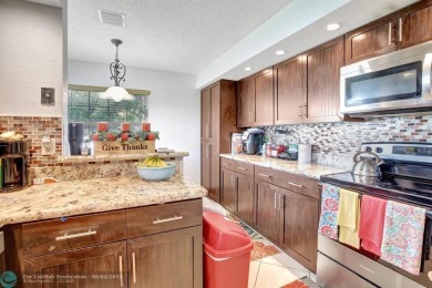 Beautiful 3BR/2.5BA townhouse with stunning golf and lake views on Woodmont Country Club in Florida - for sale on GolfHomes.com, golf home, golf lot