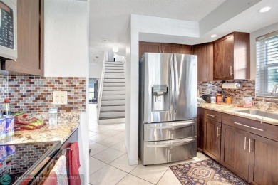 Beautiful 3BR/2.5BA townhouse with stunning golf and lake views on Woodmont Country Club in Florida - for sale on GolfHomes.com, golf home, golf lot