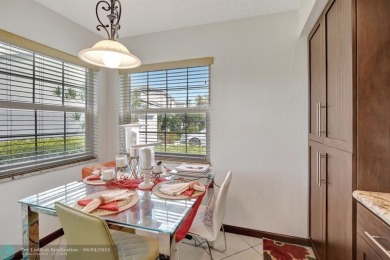 Beautiful 3BR/2.5BA townhouse with stunning golf and lake views on Woodmont Country Club in Florida - for sale on GolfHomes.com, golf home, golf lot