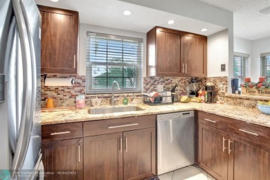 Beautiful 3BR/2.5BA townhouse with stunning golf and lake views on Woodmont Country Club in Florida - for sale on GolfHomes.com, golf home, golf lot