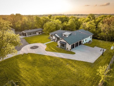 Welcome to Creekside Hideaway, a breathtaking 3-acre executive on Beaver Creek Golf Course in Iowa - for sale on GolfHomes.com, golf home, golf lot