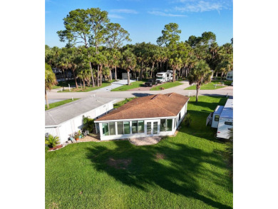 This RV site has a beautiful executive suite with a lake view on The Great Outdoors Golf and Country Club in Florida - for sale on GolfHomes.com, golf home, golf lot