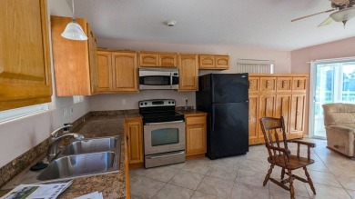 This RV site has a beautiful executive suite with a lake view on The Great Outdoors Golf and Country Club in Florida - for sale on GolfHomes.com, golf home, golf lot