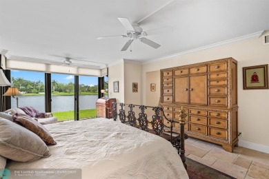 Unwind in luxury at this beautifully updated first floor on Boca West Golf and Country Club in Florida - for sale on GolfHomes.com, golf home, golf lot