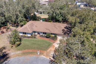 VA assumable loan 2.25%. Welcome to this charming 4-bedroom on Indian Bayou Golf and Country Club in Florida - for sale on GolfHomes.com, golf home, golf lot