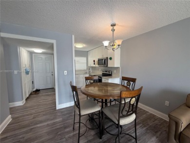 Beautifully upgraded 1 bedroom 1 bath  condo with shaker on Sunrise Lakes Phase III in Florida - for sale on GolfHomes.com, golf home, golf lot