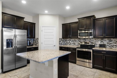 Stunning 4BD/3.5BA Pool Home with Tesla Solar System on an on Orange County National Golf Center and Lodge in Florida - for sale on GolfHomes.com, golf home, golf lot