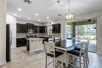 Stunning 4BD/3.5BA Pool Home with Tesla Solar System on an on Orange County National Golf Center and Lodge in Florida - for sale on GolfHomes.com, golf home, golf lot