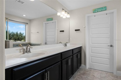 Stunning 4BD/3.5BA Pool Home with Tesla Solar System on an on Orange County National Golf Center and Lodge in Florida - for sale on GolfHomes.com, golf home, golf lot