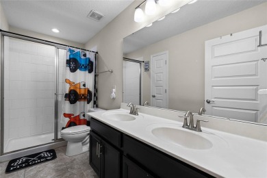 Stunning 4BD/3.5BA Pool Home with Tesla Solar System on an on Orange County National Golf Center and Lodge in Florida - for sale on GolfHomes.com, golf home, golf lot