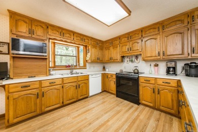 Welcome to your dream home nestled on a quiet, tree-lined on Indian Hills Country Club in Arkansas - for sale on GolfHomes.com, golf home, golf lot