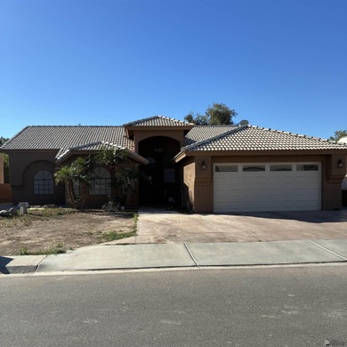 This impressive 3-bedroom home has been expertly remodeled and on Cocopah Rio Colorado Golf Course in Arizona - for sale on GolfHomes.com, golf home, golf lot