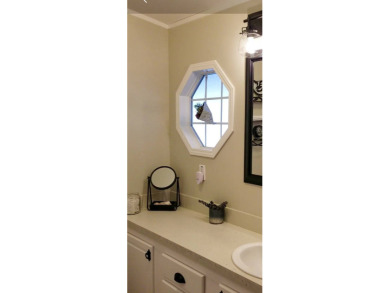 Welcome to this charming 2-bedroom, 2-bathroom manufactured home on Lily Lake Golf and RV Resort in Florida - for sale on GolfHomes.com, golf home, golf lot