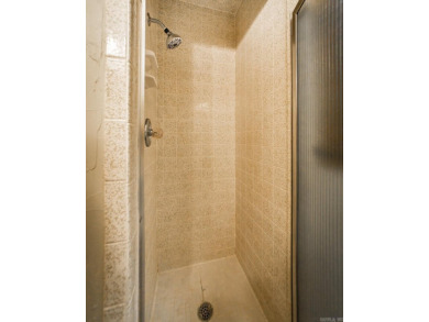 Welcome to your dream home nestled on a quiet, tree-lined on Indian Hills Country Club in Arkansas - for sale on GolfHomes.com, golf home, golf lot