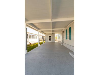 Welcome to this charming 2-bedroom, 2-bathroom manufactured home on Lily Lake Golf and RV Resort in Florida - for sale on GolfHomes.com, golf home, golf lot