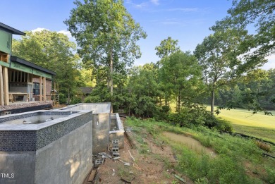 Stunning Luxury Home and Pool house on NRCC 9th Fairway of the on North Ridge Country Club in North Carolina - for sale on GolfHomes.com, golf home, golf lot