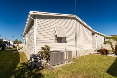 Welcome to this charming 2-bedroom, 2-bathroom manufactured home on Lily Lake Golf and RV Resort in Florida - for sale on GolfHomes.com, golf home, golf lot