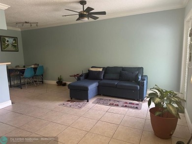 This condo has it all- tile throughout- new appliances - newer on Hillsboro Pines Golf in Florida - for sale on GolfHomes.com, golf home, golf lot