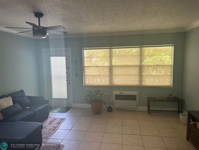 This condo has it all- tile throughout- new appliances - newer on Hillsboro Pines Golf in Florida - for sale on GolfHomes.com, golf home, golf lot