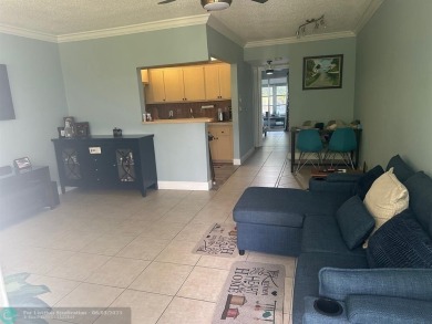 This condo has it all- tile throughout- new appliances - newer on Hillsboro Pines Golf in Florida - for sale on GolfHomes.com, golf home, golf lot