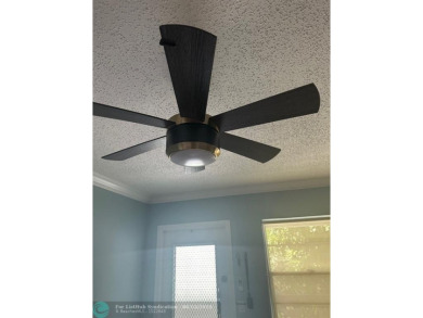 This condo has it all- tile throughout- new appliances - newer on Hillsboro Pines Golf in Florida - for sale on GolfHomes.com, golf home, golf lot