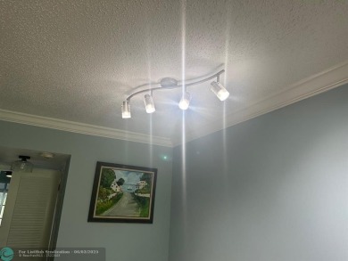This condo has it all- tile throughout- new appliances - newer on Hillsboro Pines Golf in Florida - for sale on GolfHomes.com, golf home, golf lot