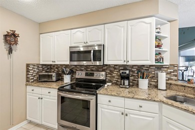 Experience the pinnacle of golf course living in this on Caloosa Greens Executive Golf Course in Florida - for sale on GolfHomes.com, golf home, golf lot