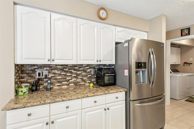 Experience the pinnacle of golf course living in this on Caloosa Greens Executive Golf Course in Florida - for sale on GolfHomes.com, golf home, golf lot