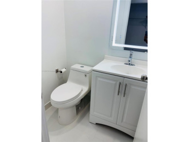 Contemporary designpletely renovated turnkey beautiful 1 bed 1.5 on Hillsboro Pines Golf in Florida - for sale on GolfHomes.com, golf home, golf lot
