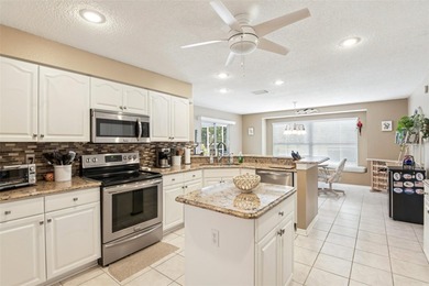 Experience the pinnacle of golf course living in this on Caloosa Greens Executive Golf Course in Florida - for sale on GolfHomes.com, golf home, golf lot