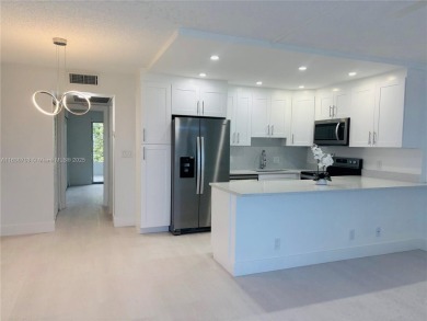 Contemporary designpletely renovated turnkey beautiful 1 bed 1.5 on Hillsboro Pines Golf in Florida - for sale on GolfHomes.com, golf home, golf lot