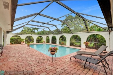 *** DISCOVER UNPARALLELED ELEGANCE NESTLED ON OVER HALF AN ACRE on Country Club of Coral Springs in Florida - for sale on GolfHomes.com, golf home, golf lot