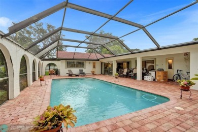 *** DISCOVER UNPARALLELED ELEGANCE NESTLED ON OVER HALF AN ACRE on Country Club of Coral Springs in Florida - for sale on GolfHomes.com, golf home, golf lot