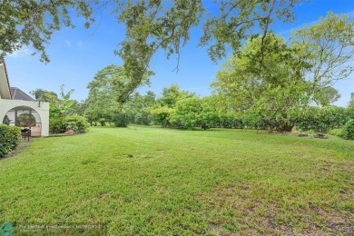 *** DISCOVER UNPARALLELED ELEGANCE NESTLED ON OVER HALF AN ACRE on Country Club of Coral Springs in Florida - for sale on GolfHomes.com, golf home, golf lot