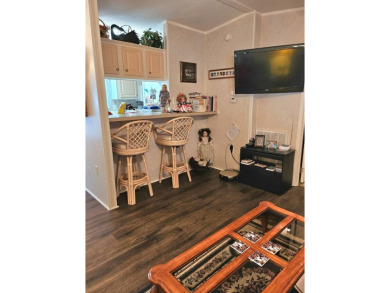 This 2 bedroom, 2 bath has approximately 1000 feet of living on Southport Springs Golf Club in Florida - for sale on GolfHomes.com, golf home, golf lot