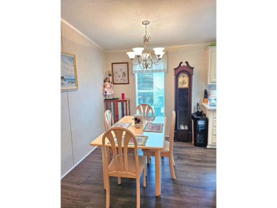 This 2 bedroom, 2 bath has approximately 1000 feet of living on Southport Springs Golf Club in Florida - for sale on GolfHomes.com, golf home, golf lot